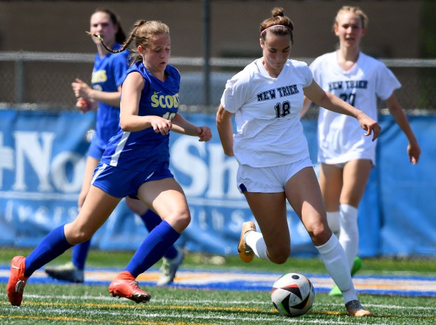 New Trier's Josie Noble (18) works her way around Lake Forest's Chloe Hvostik (16). Lake Forest's girls soccer team hosted New Trier, Saturday, May 4, 2024. (Rob Dicker/for Pioneer Press)