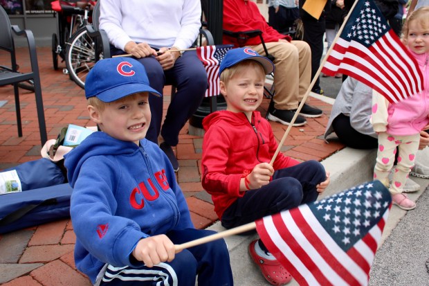 Twin brothers Nick and Evan Degen, both 5 years old from Winnetka, attend the village's 97th Annual Memorial Day Observance and Parade. (Gina Grillo/Pioneer Press)