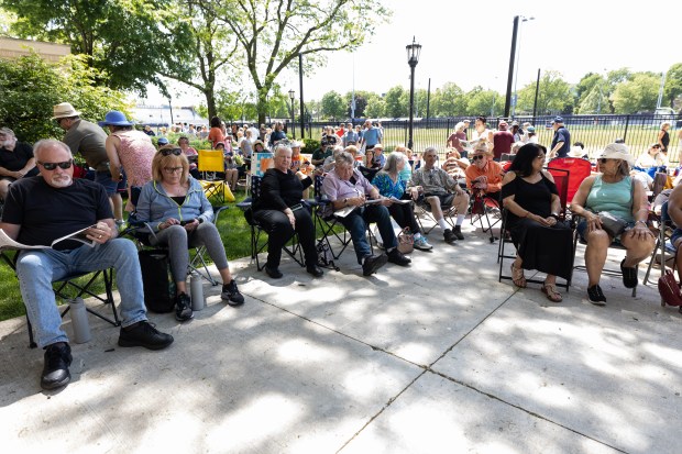 Oak Park residents gather to see The Jade 50's perform during a community block party at Oak Park-River Forest high school to celebrate the school's 150th anniversary on Sunday May 20, 2024. (Troy Stolt/for the Pioneer Press)