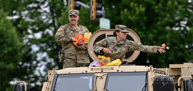 Members of the United States Army have different duty today, candy duty, at the Park Ridge Memorial Day Parade on May 27, 2024 in Park Ridge. (Karie Angell Luc/Pioneer Press)