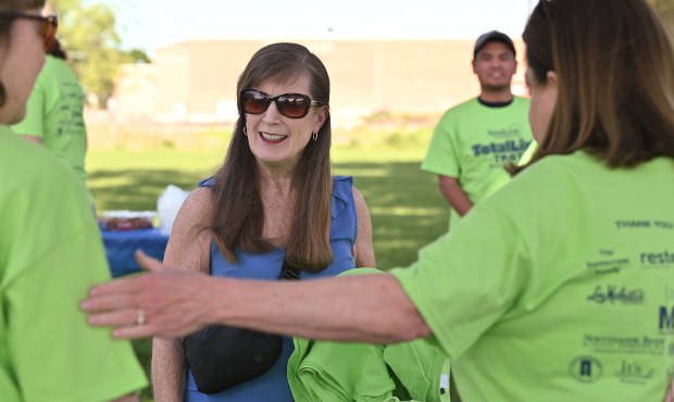 Center, Cathy Brandell of Northbrook checks in as a participant of the TotalLink Trot in Northbrook on May 19, 2024 at Techny Prairie Park and Fields. (Karie Angell Luc/Pioneer Press)