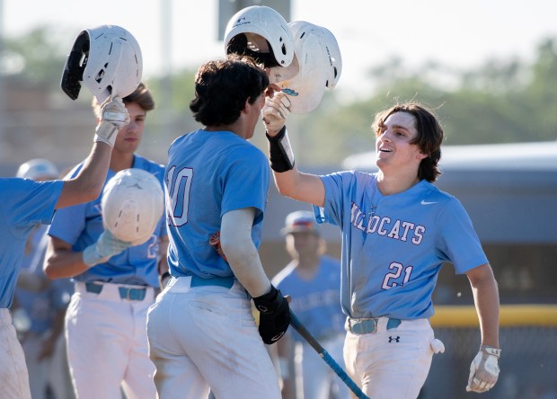 Hanover Central's Landon Sarkey, right, is congratulated by his teammates after scoring during a game in the first round of the Class 3A Highland Sectional against Andrean on Wednesday, May 22, 2024. (Michael Gard/for the Post-Tribune)