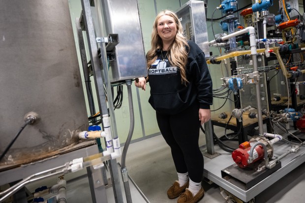 Whiting High School junior Savanah Steele smiles as she is instructed to push a button to start a pump during a training demonstration at Girls in STEM Day at the BP Whiting Refinery on Friday, May 17, 2024. (Kyle Telechan/for the Post-Tribune)