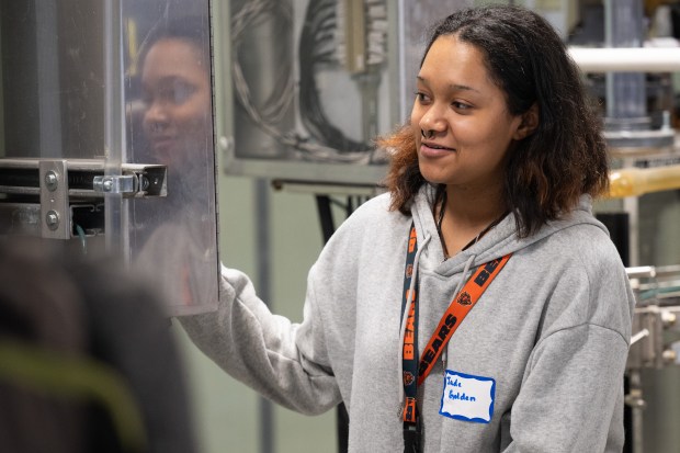 Morton High School sophomore Jade Golden participates in a demonstration of a model training pump during Girls in STEM Day at the BP Whiting Refinery on Friday, May 17, 2024. (Kyle Telechan/for the Post-Tribune)