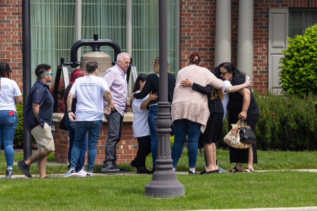 Mourners console each other after the funeral of 10-year old Dakota Levi Stevens, Monday, May 6, 2024, in Crown Point. (Vincent D. Johnson/for the Post-Tribune)