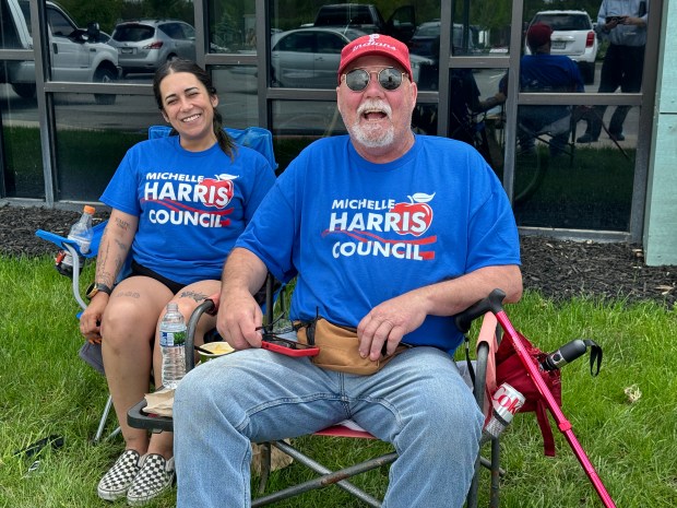 Portage City Councilwoman Melissa Weidenbach and Mark Mikels, supporting Republican Porter County Council at-large candidate Michelle Harris, greet voters outside the North County Government Complex in Portage on Tuesday, May 7, 2024. (Doug Ross/for Post-Tribune)