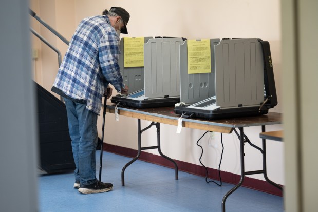Gary resident Mark Superczynski stands at a voting machine at the the G5-04 polling location at Gary Fire Department Station 13 on election day, Tuesday, May 7, 2024. (Kyle Telechan/for the Post-Tribune)