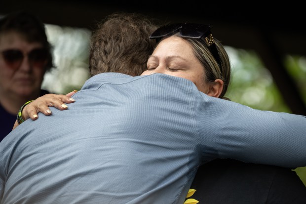 Rachel Carlisle, who lost her daughter Mariah to overdose in 2020, hugs U.S. Rep. Frank J. Mrvan, D-Highland, during the 2nd Annual We Fight Together Drug Poisoning and Overdose Awareness run/walk on Saturday, May 11, 2024. (Kyle Telechan/for the Post-Tribune)