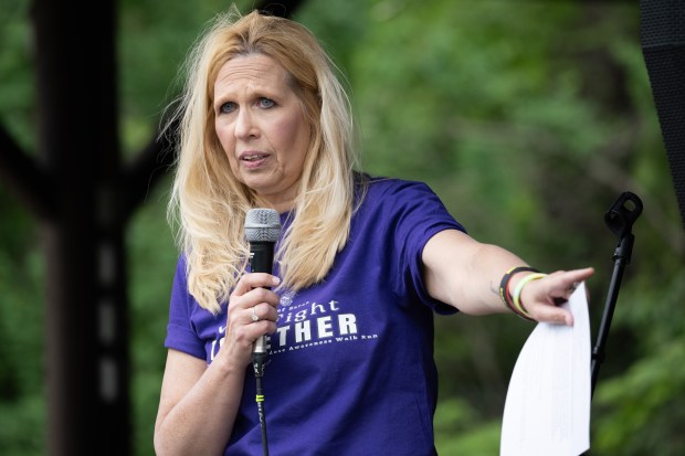 Sounds of Sarah founder Patty Stovall, who lost her daughter to fentanyl poisoning, speaks before the 2nd Annual We Fight Together Drug Poisoning and Overdose Awareness run/walk on Saturday, May 11, 2024. (Kyle Telechan/for the Post-Tribune)