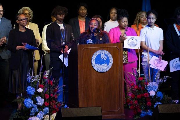 Gary Community School Corporation Chief of Schools Dr. Esther Goodes is joined on stage by recognized students and teachers before Mayor Eddie Melton's State of the City Address at West Side Leadership Academy in Gary on Tuesday, April 30, 2024. (Kyle Telechan/for the Post-Tribune)