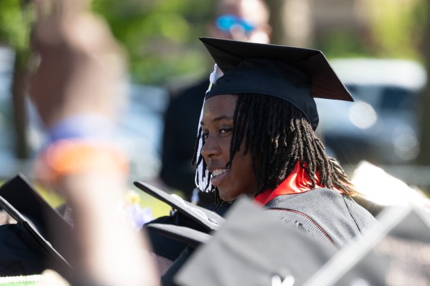 Fifteen-year-old Khaya Njumbe stands to be recognized as Indiana University Northwest's youngest graduate during the school's commencement ceremonies on Wednesday, May 8, 2024. (Kyle Telechan/for the Post-Tribune)