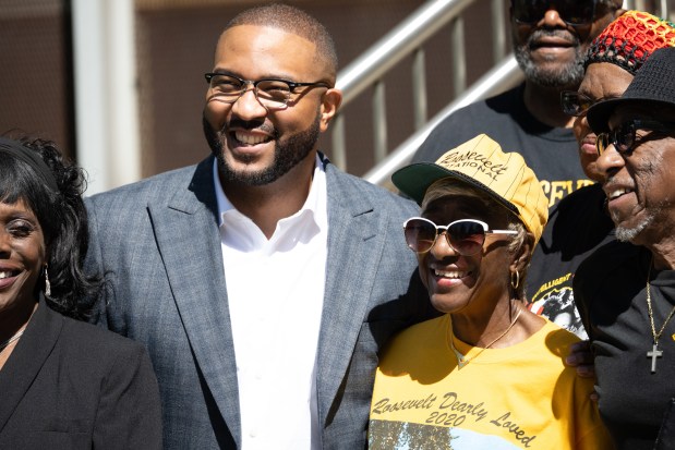 Gary Mayor Eddie Melton, on left, and National Gary Theodore Roosevelt Alumni Association president Judy Leek-Mead pose for a photo after a press conference announcing Roosevelt's place on the National Trust for Historic Preservation's 11 Most Endangered Historic Places list on Wednesday, May 1, 2024. (Kyle Telechan/for the Post-Tribune)