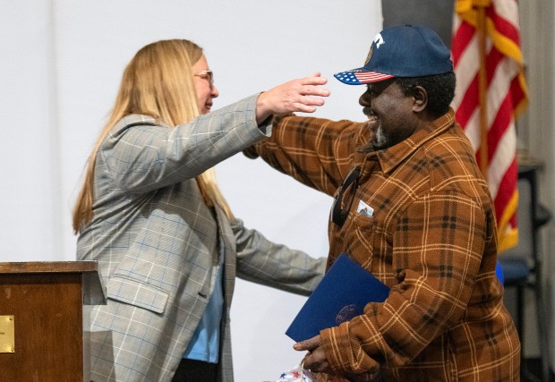 Judge Julie Cantrell, left, hugs graduate Samual Hall, Jr. during the graduation ceremony for Veterans Treatment Court at the Lake County Courthouse on Wednesday, May 15, 2024. (Michael Gard/for the Post-Tribune)