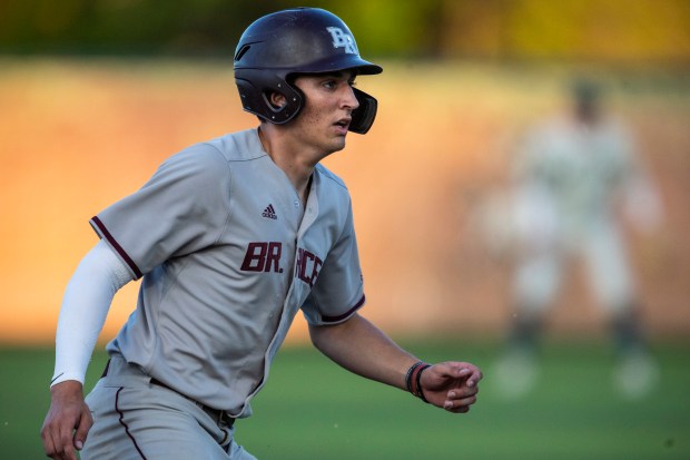 Brother Rice's Ryan Hartz takes a lead off the base against Evergreen Park during a nonconference game in Evergreen Park on Friday, May 10, 2024. (Vincent D. Johnson/for the Daily Southtown)