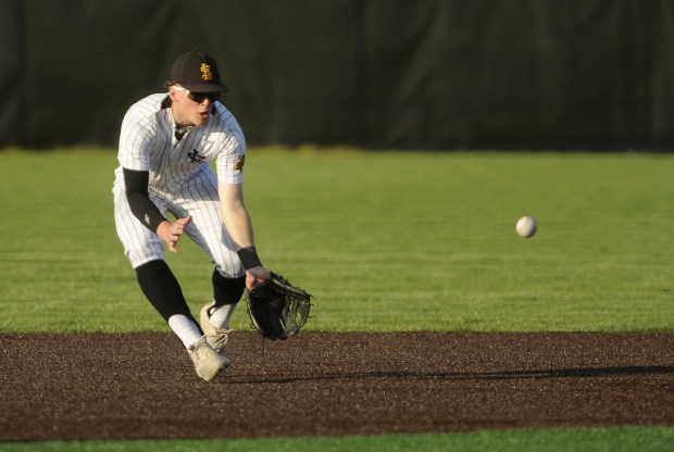 St. Laurence's short stop Jameson Martin (5) fields the ball against Brother Rice during a Chicago Catholic League game Monday, May 6, 2024 in Burbank, IL. (Steve Johnston/Daily Southtown)