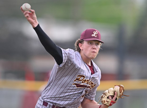 Lockport pitcher, Cal Korosa (13) checks a runner at 1st base during the 5th inning of Thursday's game at Marist, May 2, 2024. Lockport won the game, 12-5. (Brian O'Mahoney for the Daily Southtown)