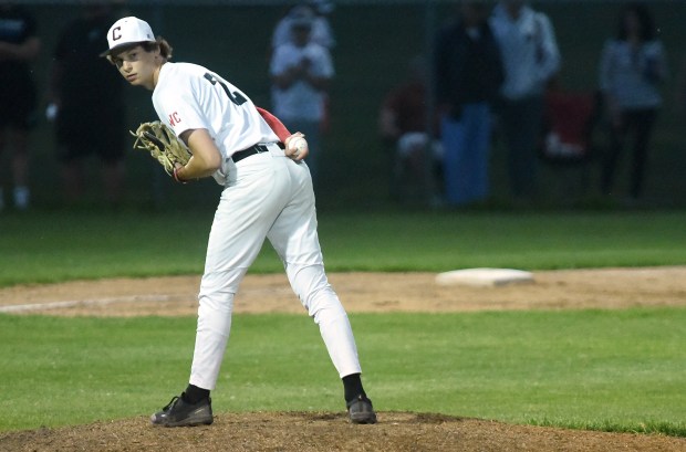 Lincoln-Way Central's pitcher Joey Zietara (2) checks the runner on first before delivering a pitch against Lincoln-Way East during a Southwest Suburban Conference game Friday, May 17, 2024 in New Lenox, IL. (Steve Johnston/Daily Southtown)