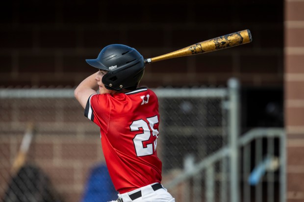 Marist's Tommy Hosty looks up after connecting on a pitch in the second inning against Lincoln-Way East during a nonconference game in Chicago on Wednesday, May 8, 2024. (Vincent D. Johnson/for the Daily Southtown)