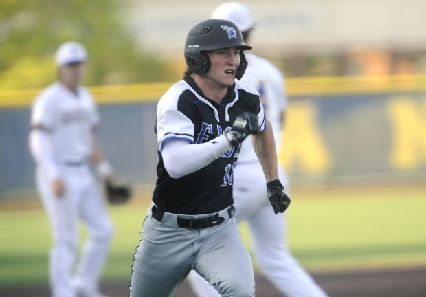 Lincoln-Way East's Charlie Cosich (10) comes around to score a run against Sandburg during a Southwest Suburban Conference game Wednesday, May 15, 2024 in Orland Park, IL. (Steve Johnston/Daily Southtown)