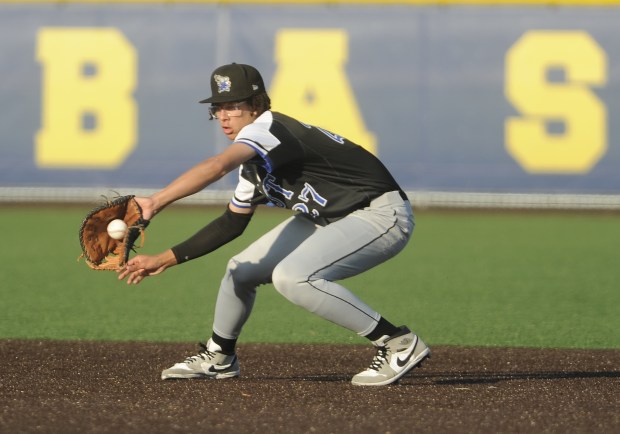 Lincoln-Way East's first baseman Danny Mackey (27) fields the ground ball against Sandburg during a Southwest Suburban Conference game Wednesday, May 15, 2024 in Orland Park, IL. (Steve Johnston/Daily Southtown)