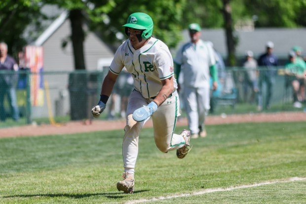 Providence's Enzo Infelise (9) runs home during a game against Lincoln-Way West in New Lenox on Saturday May 11, 2024. (Troy Stolt/for the Daily Southtown)