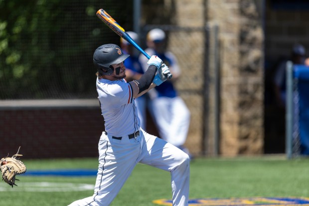 Lincoln-Way West's Jack Linko looks up after connecting on a pitch against Sandburg during the Class 4A Sandburg Regional final in Orland Park on Saturday, May 25, 2024. (Vincent D. Johnson/for the Daily Southtown)