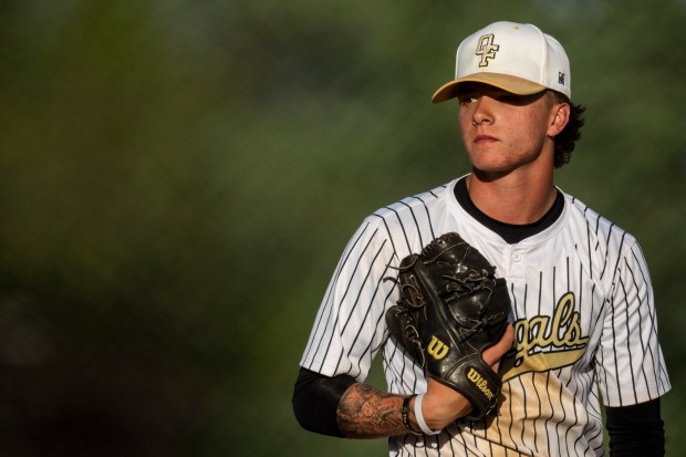 Oak Forest's Justin Gibbs looks for the sign from his catcher during a South Suburban Blue game against T.F. South in Lansing on Tuesday, May 7, 2024. (Vincent D. Johnson/for the Daily Southtown)