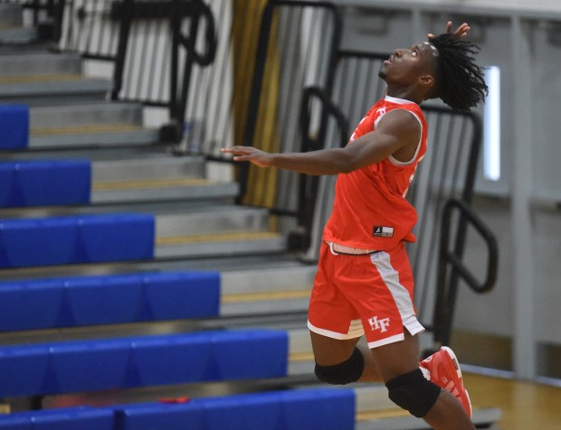 Homewood-Flossmoor's Ahmad Powell (14) goes up for a serve attempt against Sandburg during a Southwest Suburban Conference game Tuesday, May 7, 2024 in Orland Park, IL. (Steve Johnston/Daily Southtown)