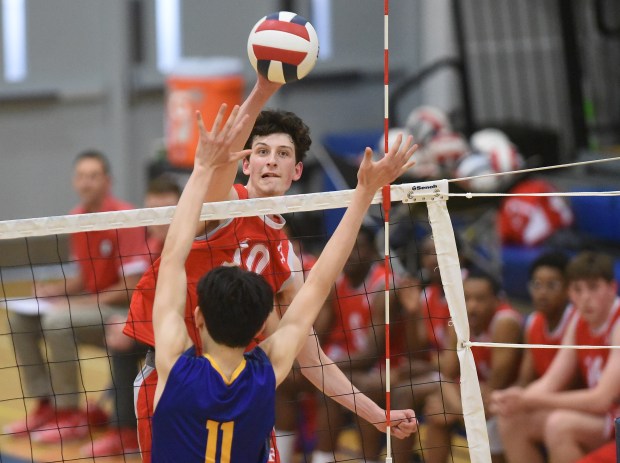 Homewood-Flossmoor's Nathan Epley (10) sends the ball past Sandburg's Easton Donausky (11) during a Southwest Suburban Conference game Tuesday, May 7, 2024 in Orland Park, IL. (Steve Johnston/Daily Southtown)