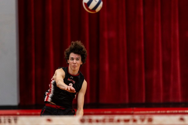 Marist's Christian Teresi (2) serves against Jones in the Marist Sectional final in Chicago on Tuesday, May 28, 2024. (Vincent D. Johnson/for the Daily Southtown)