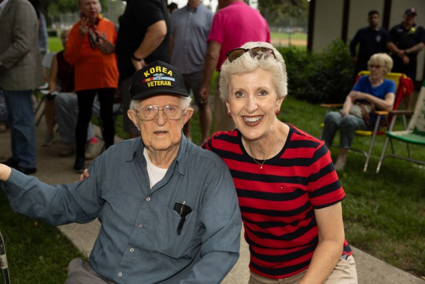 Author Kristine Condon, of Homewood, sits with her father, Richard Condon, last fall during a ceremonial groundbreaking for a new Veterans Memorial in Flossmoor. (Flossmoor Veterans Memorial)