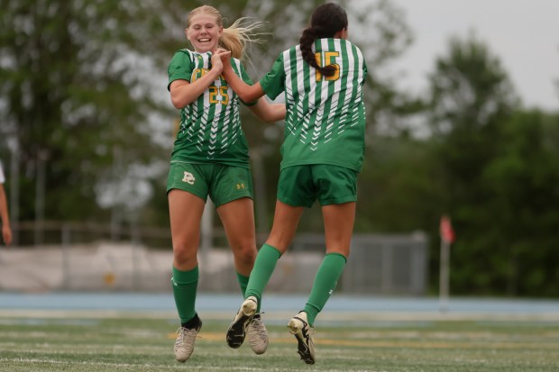 Providence's Giuliana Savarino (15) celebrates scoring a goal with Alexa Thompson (25) during the Class 2A Kankakee Sectional final against Tinley Park in Kankakee on Friday, May 23, 2024. (Troy Stolt/for the Daily Southtown)