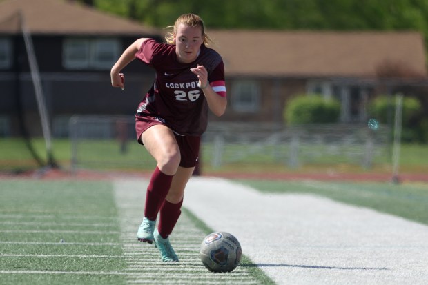 Lockport's Meghan Mack (26) brings the ball down field during a game against Lincoln-Way East in Lockport on Saturday May 4, 2024. (Troy Stolt/for the Daily Southtown)