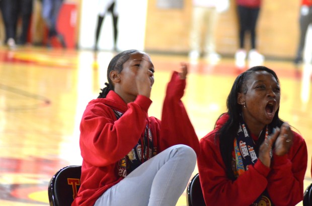 Tinley Park's Gabby Graham, left, and Janiyah Oglesby react to a video honoring the girls track team at an assembly on Monday, May 20, 2024. (Jeff Vorva / Daily Southtown)