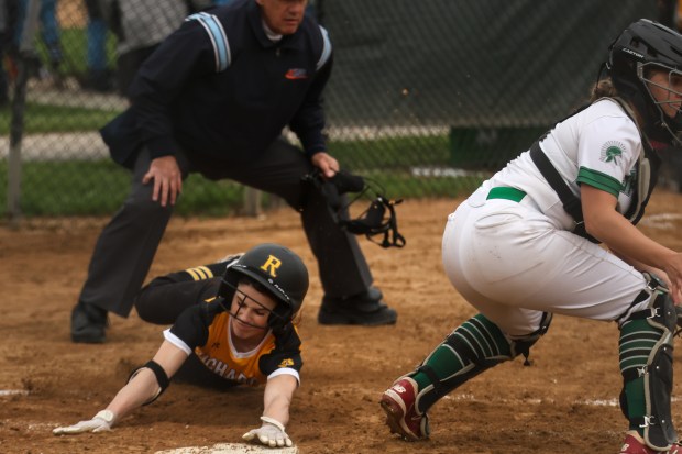 Richard's Abby Cole (6) slides into home plate during a game against Oak Lawn on Tuesday May 14, 2024. (Troy Stolt/for the Daily Southtown)