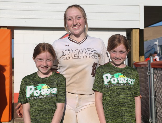 Shepard third baseman Meghan Potenza (8, center) poses for a portrait with her sisters Emily Potenza (left) and Grace Potenza (right) following a game at Shepard High School in Palos Heights on Wednesday, May 15, 2024. (Trent Sprague/for the Daily Southtown)