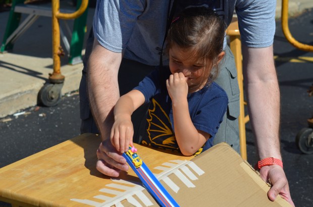 St. George pre-kindergartner Brooklyn Kmiecik of Chicago Heights gets ready to take her duck and car and compete in the finals of the duck races May 28, 2024. (Jeff Vorva/for Daily Southtown)