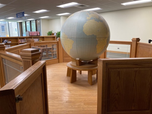 A 50-inch globe created by Weber Costello Co. in Chicago Heights, along with the U.S. War Department, is displayed at Bloom High School in Chicago Heights. (Paul Eisenberg/Daily Southtown)