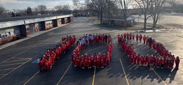 St. Christopher students line up in the parking lot recently to celebrate the school being open for 100 years. (St. Christopher School)