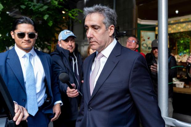 FILE - Michael Cohen leaves his apartment building on his way to Manhattan criminal court, May 13, 2024, in New York. Donald Trump's hush money trial is heading into the final stretch. The landmark trial will kick back off Monday, May 20, in Manhattan with more defense cross-examination of former Trump attorney Cohen. Cohen's pivotal testimony directly tied Trump to the alleged hush money scheme. Defense lawyers are trying to paint Cohen as a serial fabulist who is on a revenge campaign against the presumptive Republican presidential nominee. (AP Photo/Julia Nikhinson, File)