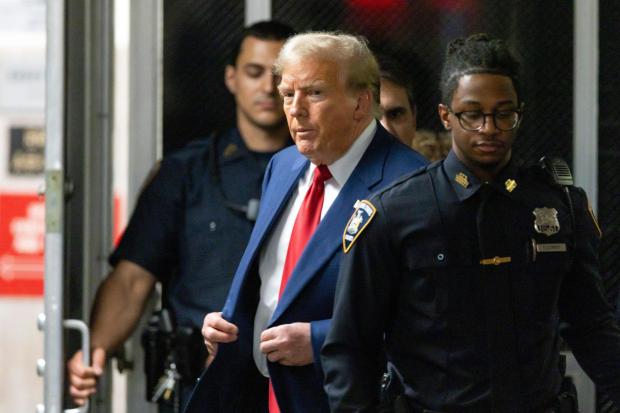 Former President Donald Trump leaves the courtroom following the day's proceedings in his trial at Manhattan criminal court in New York, Tuesday, April 30, 2024. (Justin Lane/Pool Photo via AP)