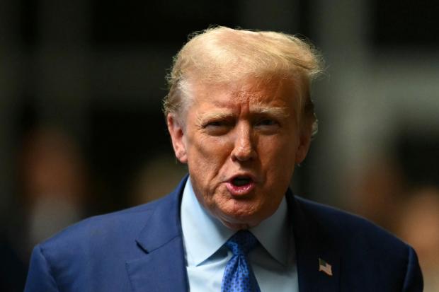 Former President Donald Trump speaks to the media at the end of the day of his hush money trial, in New York, Thursday, May 9, 2024. (Angela Weiss/Pool Photo via AP)