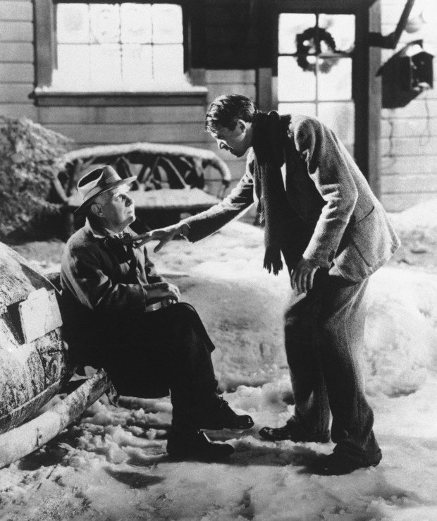 Henry Travers as Clarence the angel, left, and James Stewart as George Bailey in the 1946 film "It's A Wonderful Life."