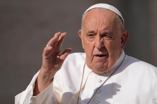 FILE - Pope Francis arrives for his weekly general audience in St. Peter's Square, at the Vatican, Wednesday, May 22, 2024. Pope Francis apologized Tuesday, May 28, 2024, after he was quoted using a vulgar term about gays to reaffirm the Catholic Church's ban on gay priests. Vatican spokesman Matteo Bruni issued a statement acknowledging the media storm that erupted about Francis' comments, which were delivered behind closed doors to Italian bishops on May 20. (AP Photo/Andrew Medichini, File)