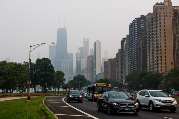 Vehicles move along DuSable Lake Shore Drive as smoke from Canadian wildfires passes through the region, June 27, 2023, in Chicago. (Armando L. Sanchez/Chicago Tribune)