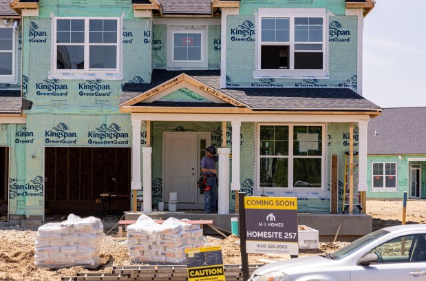 New houses are under construction off Wolf's Crossing Road in a suburban development of Oswego on May 15, 2024, in Kendall County. (Brian Cassella/Chicago Tribune)