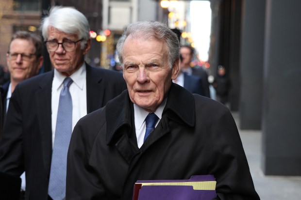 Former Illinois House Speaker Michael J. Madigan, foreground, leaves the Dirksen U.S. Courthouse in Chicago on Jan. 3, 2024. (Terrence Antonio James/Chicago Tribune)