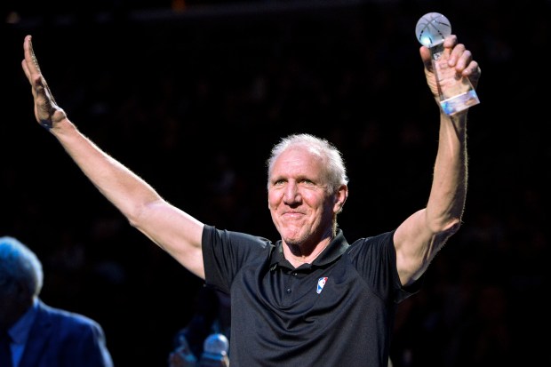 Bill Walton raises his hands as he stands with fellow recipients of the annual National Civil Rights Museum Sports Legacy Award before the annual Martin Luther King Jr. Celebration Game between the New Orleans Pelicans and the Memphis Grizzlies Monday, Jan. 21, 2019, in Memphis, Tenn. Wayne Embry, Candace Parker, and Chris Bosh were also honored. (Brandon Dill/AP)