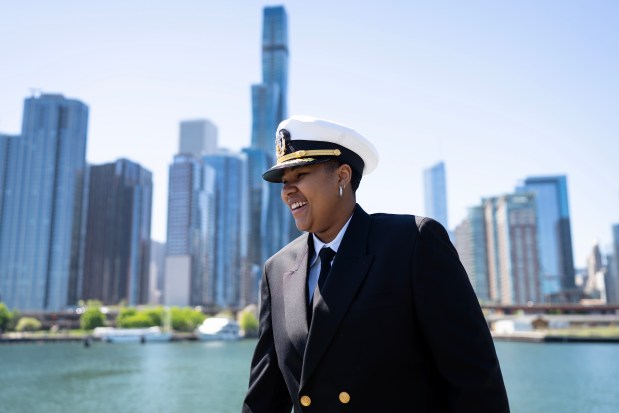 Diamond Gibbs, the youngest boat captain for Chicago's First Lady Cruises, chats with a passenger on a Chicago Architecture Center River Cruise on the Chicago River, April 30, 2024. (E. Jason Wambsgans/Chicago Tribune)