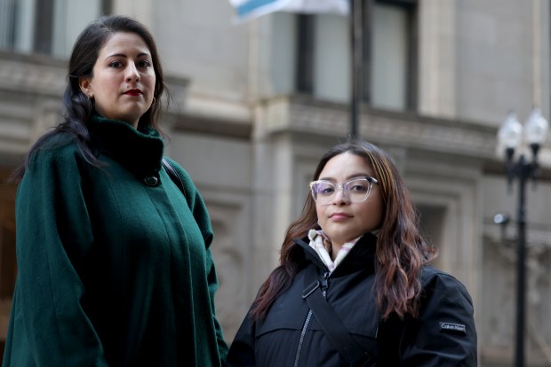 Dora Meza, left, and Azhley Rodriguez, outside City Hall on Jan. 5, 2024. Multiple former City Hall staffers from the Lightfoot era were fired and placed on "do-not-hire" list. (Antonio Perez/Chicago Tribune)